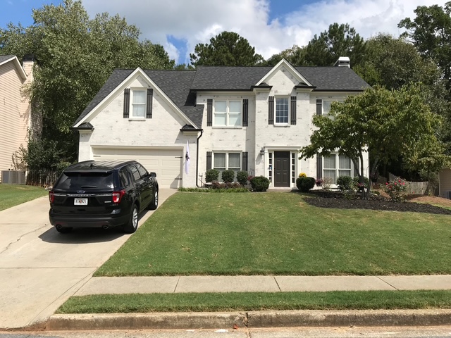 Limewashed brick home exterior in North Atlanta, GA — AAA Construction Services