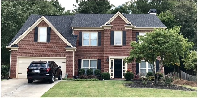 Brick home before limewash in North Atlanta, GA — AAA Construction Services