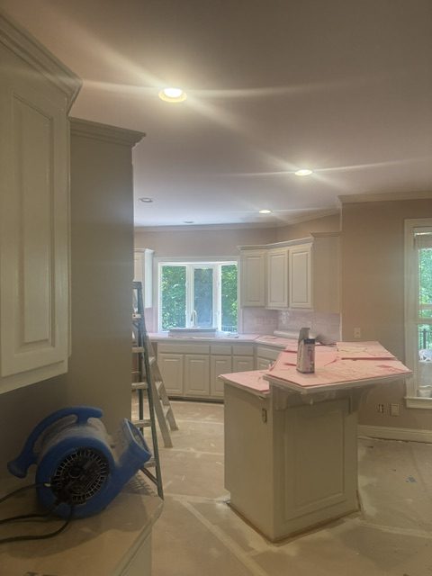 Converting stained oak cabinets to a sprayed finish.